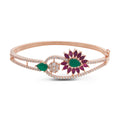 rose gold bracelet with pink and green crystals along with white stones